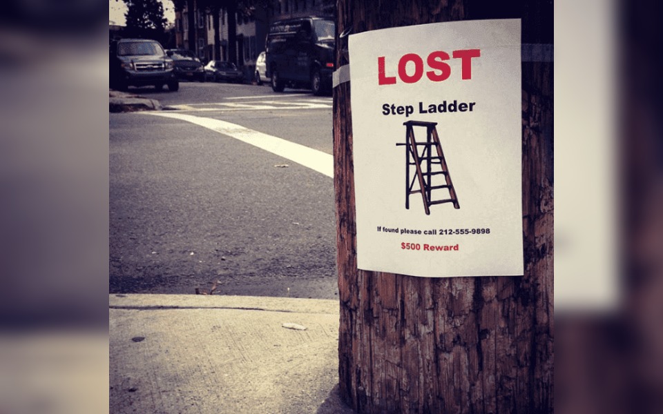 a street poster that reads "lost step ladder"