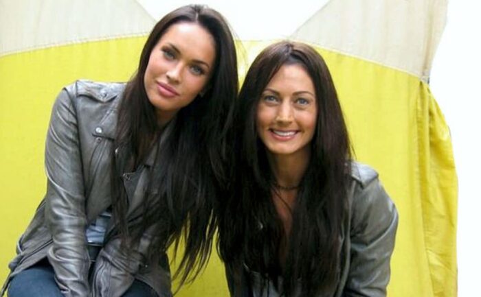 Megan Fox takes a picture with her stunt double.
