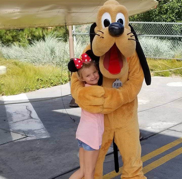 Natalee Pearson hugging Pluto