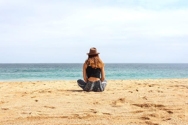 woman sitting on the beach
