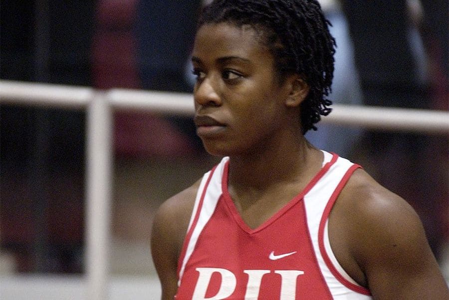 Photograph of Uzo Aduba in her track uniform ready to run.