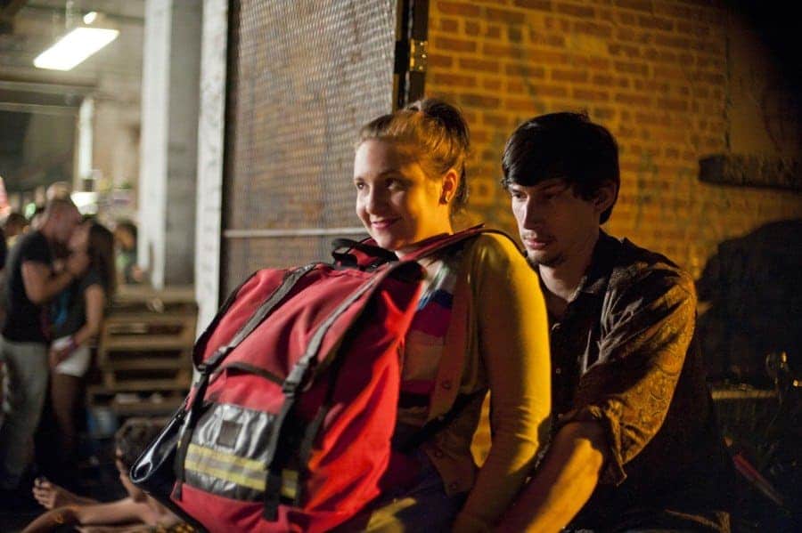 Lena Dunham was riding on the handlebars of Adam Drivers bike on the set of Girls. 