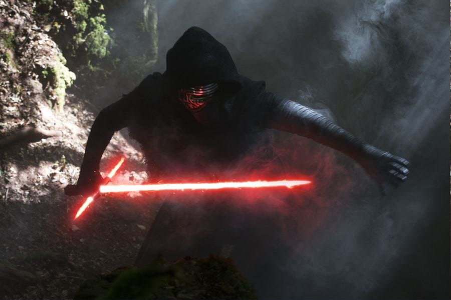 Adam Driver in costume on the set of Star Wars the Force Awakens intensely going after someone. 