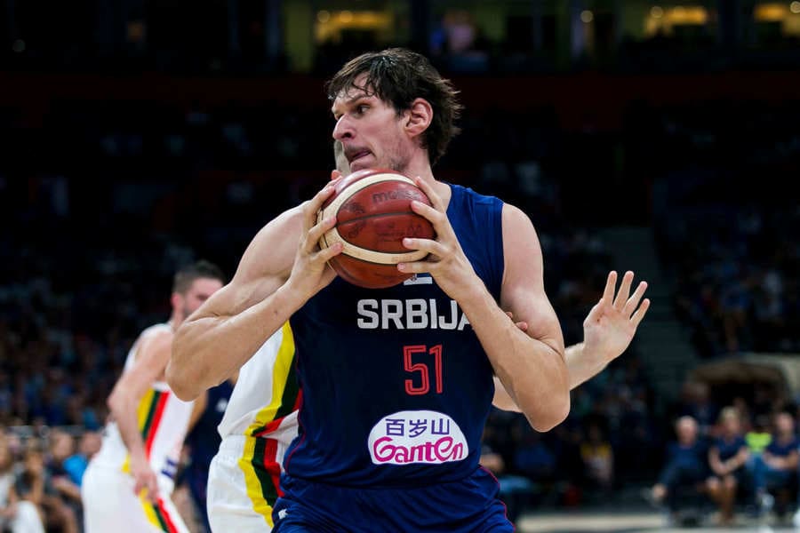 Boban Marjanovic about to pass the ball in the game Serbia v Lithuania.