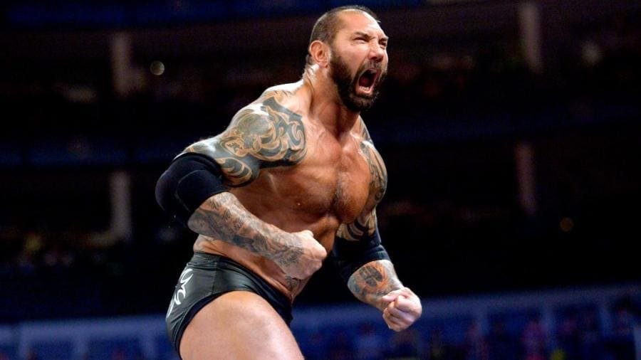 Dave Bautista arms flexing and ready for a match.