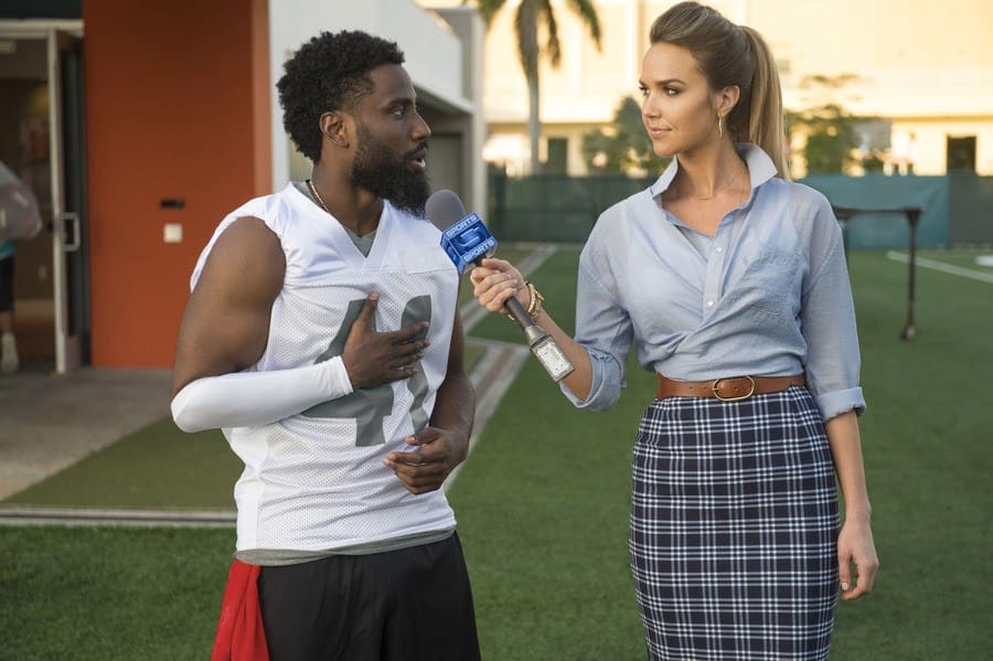 John David Washington and Arielle Kebbel in the movie Ballers.