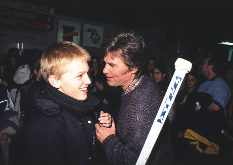 Wyatt Russell talking to his dad after the game where he was the goalie.