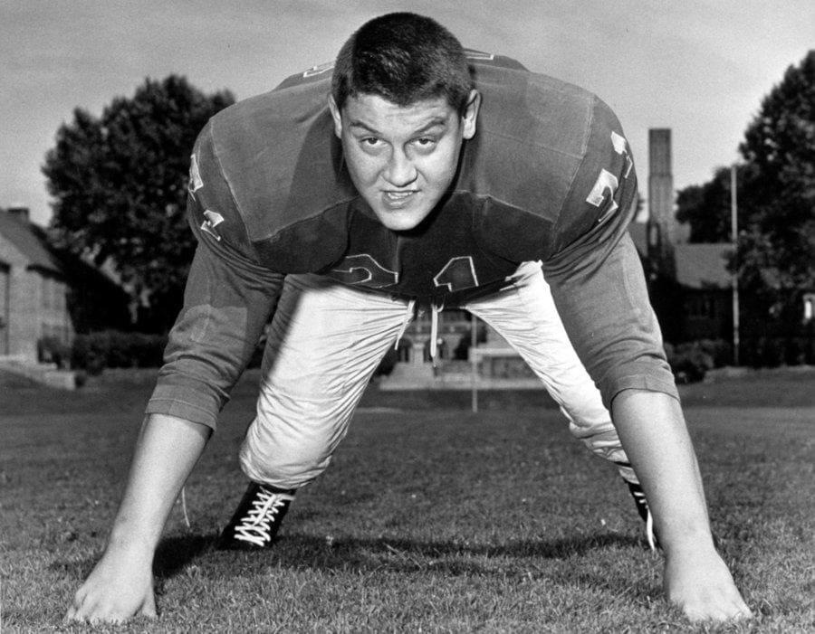 Alex Karras in stance on the football field.