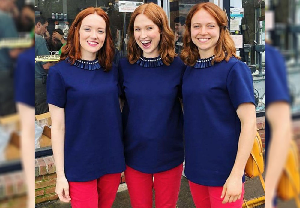 Kara Rosella, Ellie Kemper, and Abby Nelson all posing in the same pink pants and royal blue shirt.