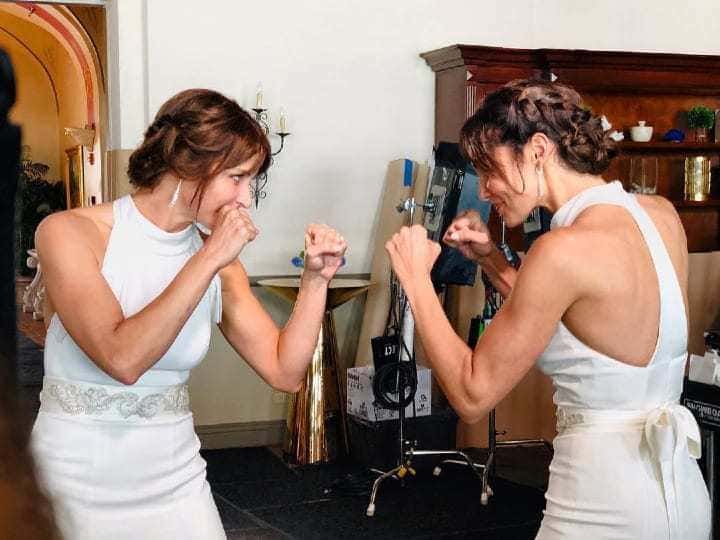 Daniela Ruah and Kimberly Shannon Murphy are sparring in wedding dresses.