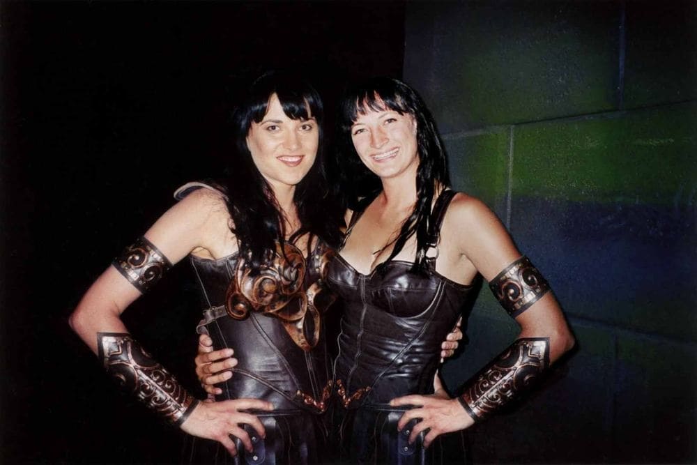 Lucy Lawless and Zoe Bell in character for Xena: Warrior Princess.