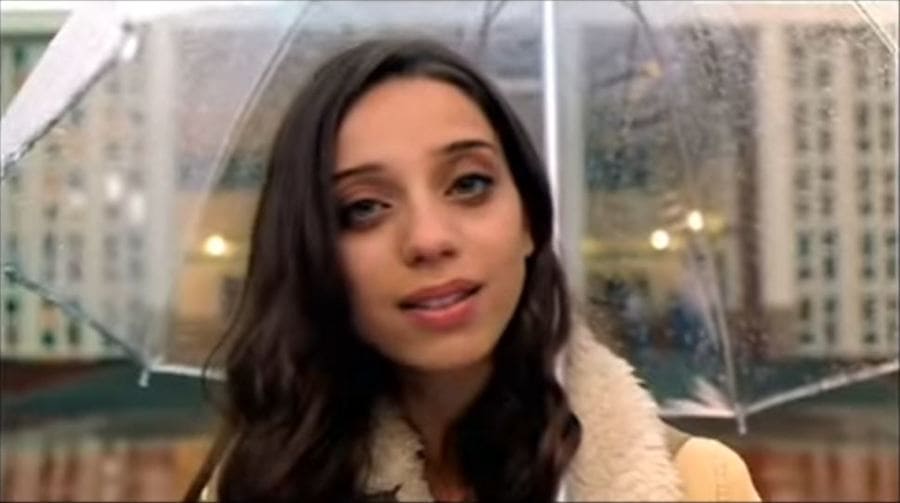 Angela Sarafyan under a clear umbrella.
