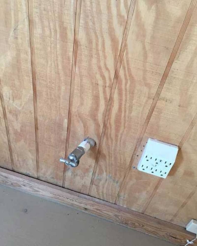 An electricity socket near a water faucet