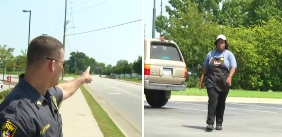 Officer Bass pointing to the road, Jaylesya Corbett walking