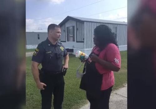 Officer Bass talking to Jayleysa Corbett