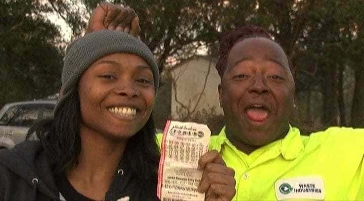 Marie Holmes photographed with a friend and her winning lottery ticket held up.