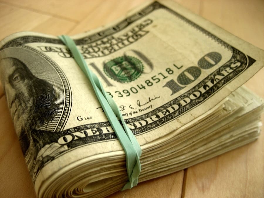 A large wad of $100 bills is pictured above.