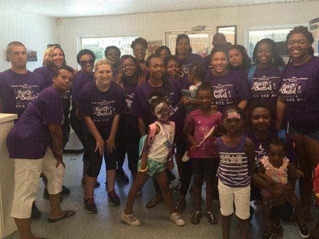 Members of The Marie Holmes Foundation, who hosted the Back to School drive.