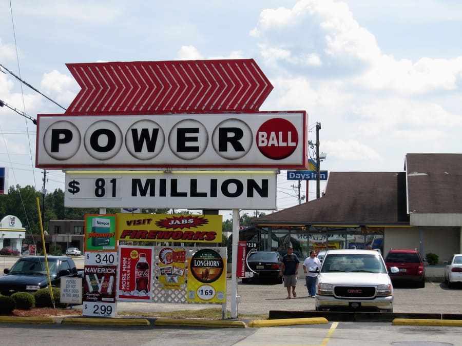 Photograph of a sign for the Power Ball lottery at $81 million outside of a Days Inn gas station.