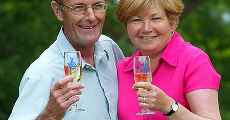 Louise Gough and husband Keith celebrating after receiving their winning lottery check.