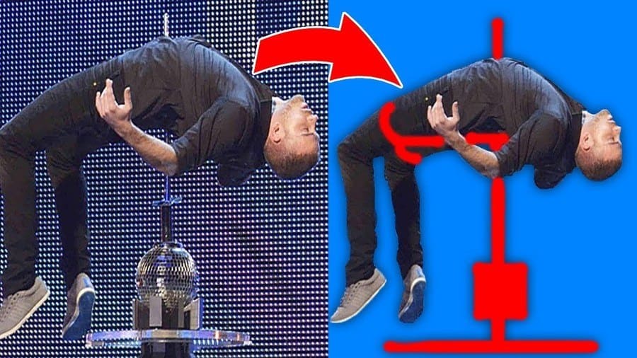 magician lying on a spike