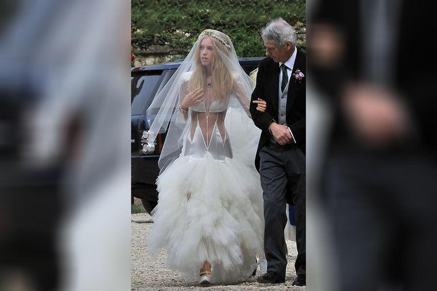 A bride wearing a revealing wedding dress