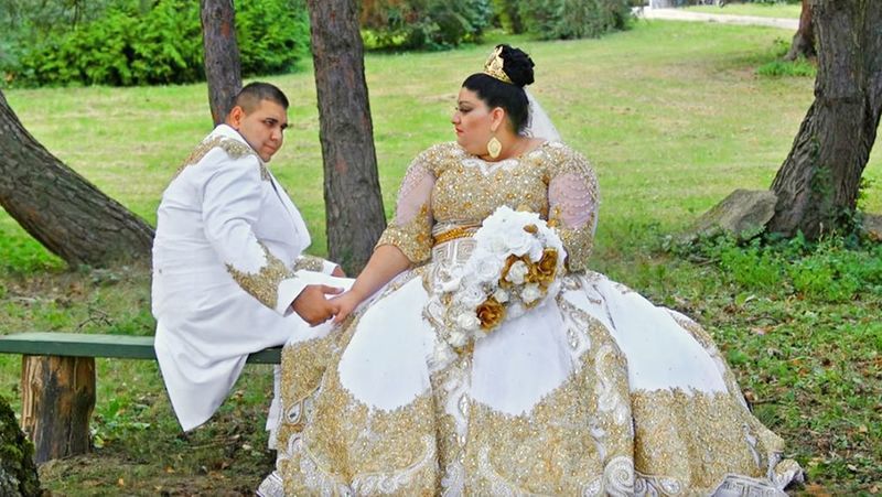 A woman wearing an “extra” wedding dress
