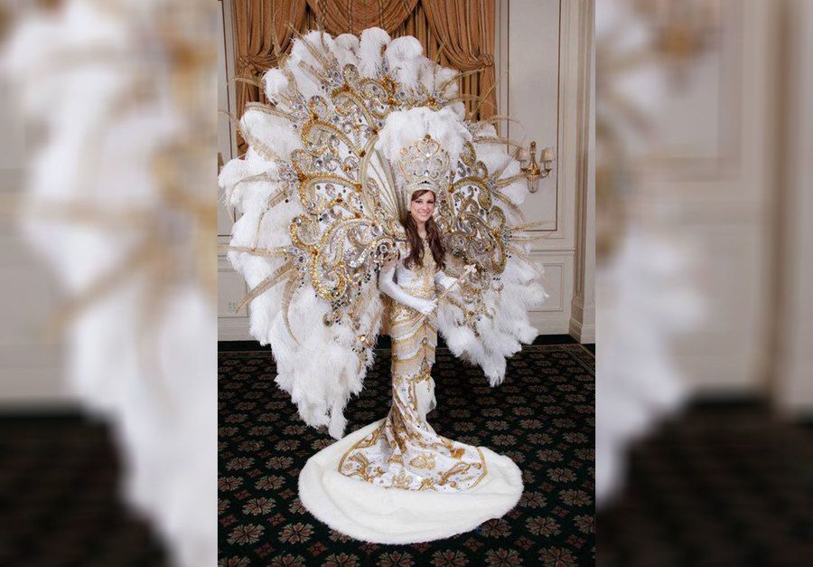 A girl wearing a wedding dress designed for a queen
