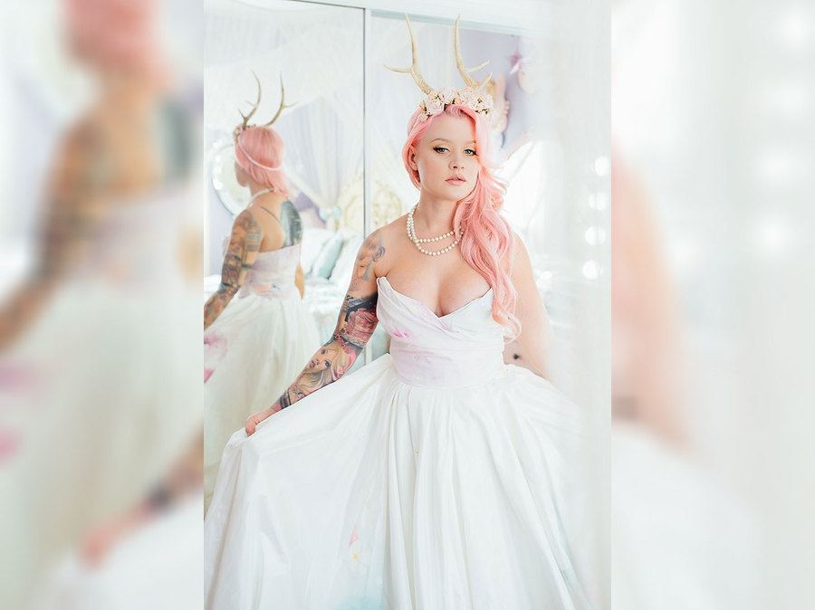 A bride in horns and a wedding dress