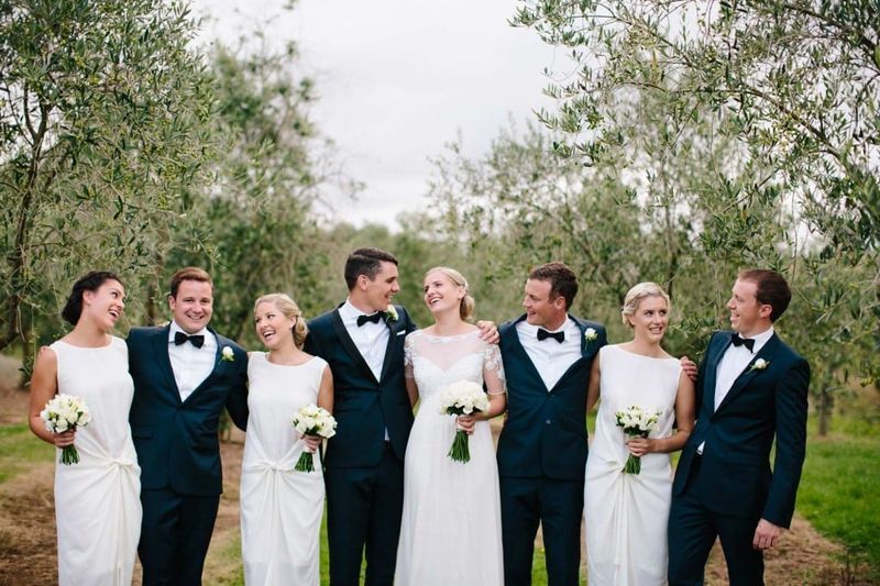 Bridesmaids wearing white dresses