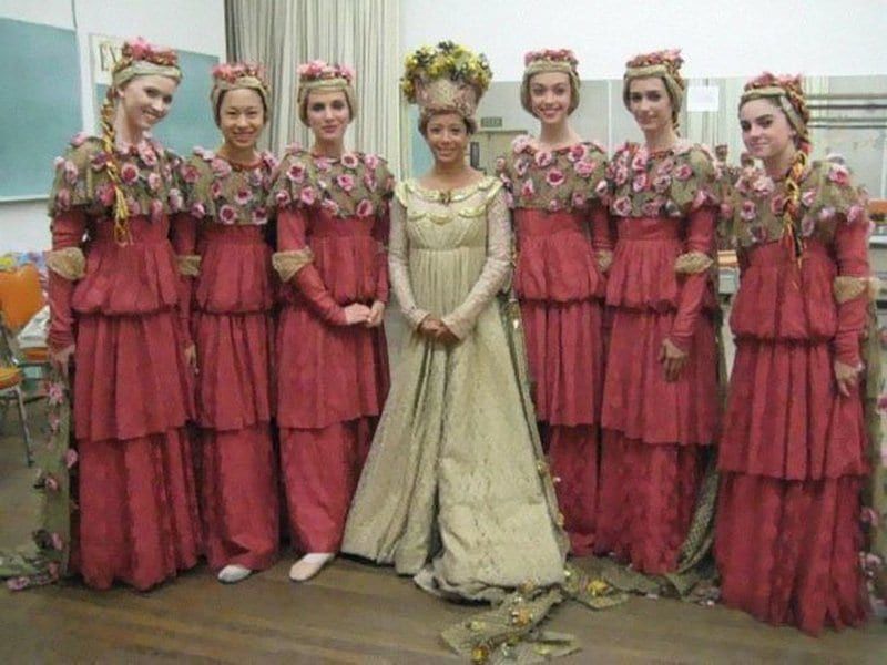 A bride and her bridesmaids dressed in a Victorian style