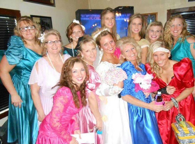 A bride and her bridesmaids wearing ugly dresses