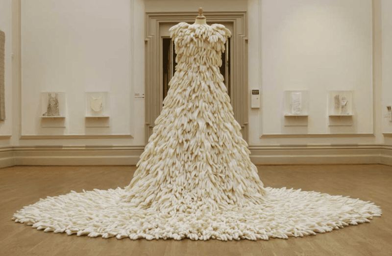A wedding dress made completely out of white gloves