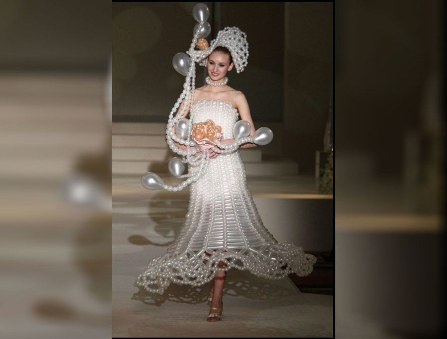 A bride wearing a balloon wedding dress