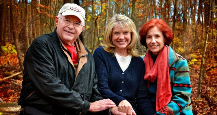 Denis, Karen, and Jean in front of the trees in the fall.