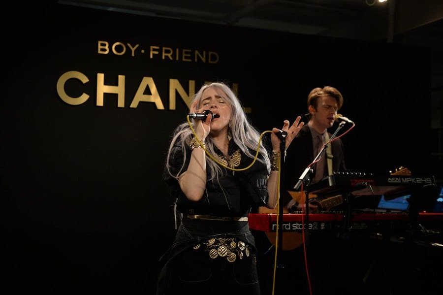 Billie Eilish and Finneas performing together at the Chanel launch for The Coco Club in 2017.