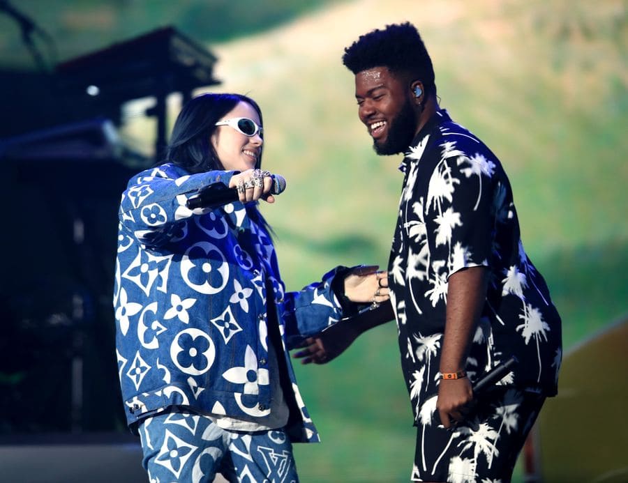 Billie Eilish and Khalid about to hug and say hi on stage at Coachella in 2019.