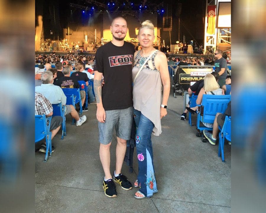 Kasey Bergh and Henry Glendening watching musicians play Led Zeppelin and Pink Floyd