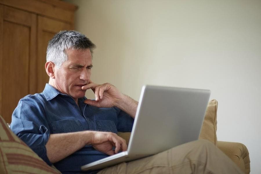 man chatting using a laptop