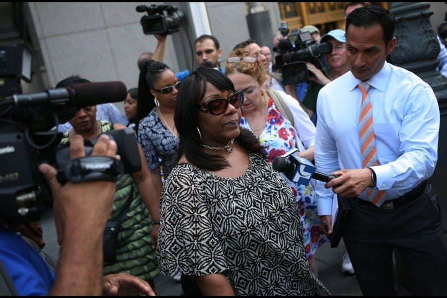 Joy White, speaking to reporters