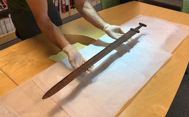 The sword being examined