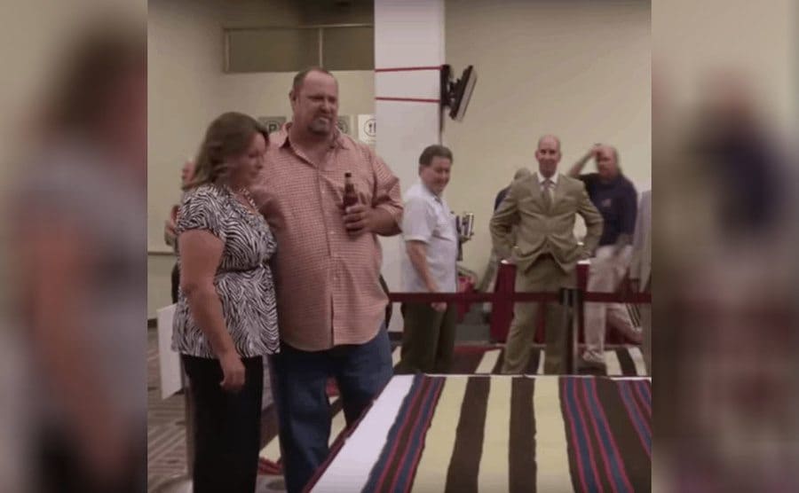 Loren and his wife looking at the blanket 