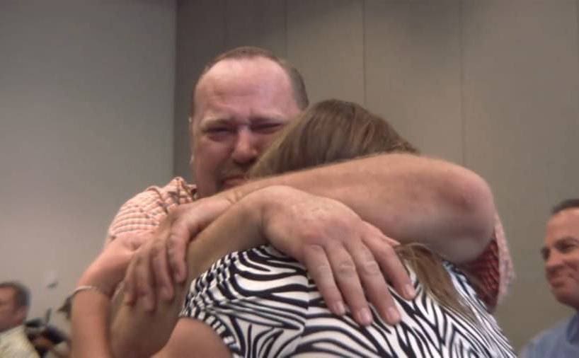 Loren and his wife embracing 