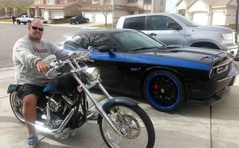 Loren with his Harley Davidson and Mustang 