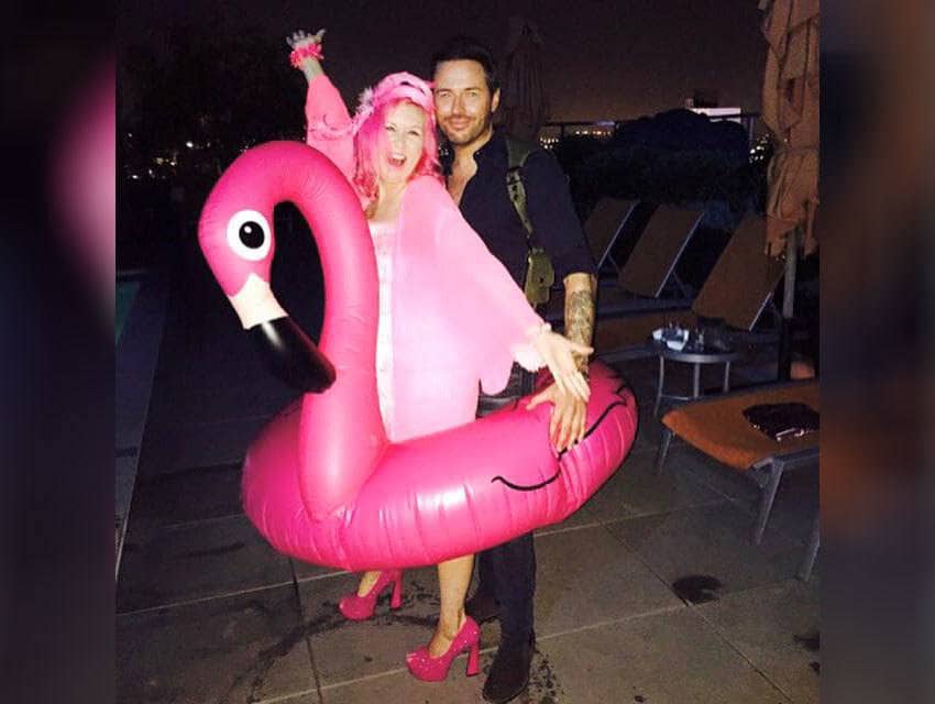 Kitten Kay Sera and Jordan Cappella inside of a pink blow-up flamingo pool ring