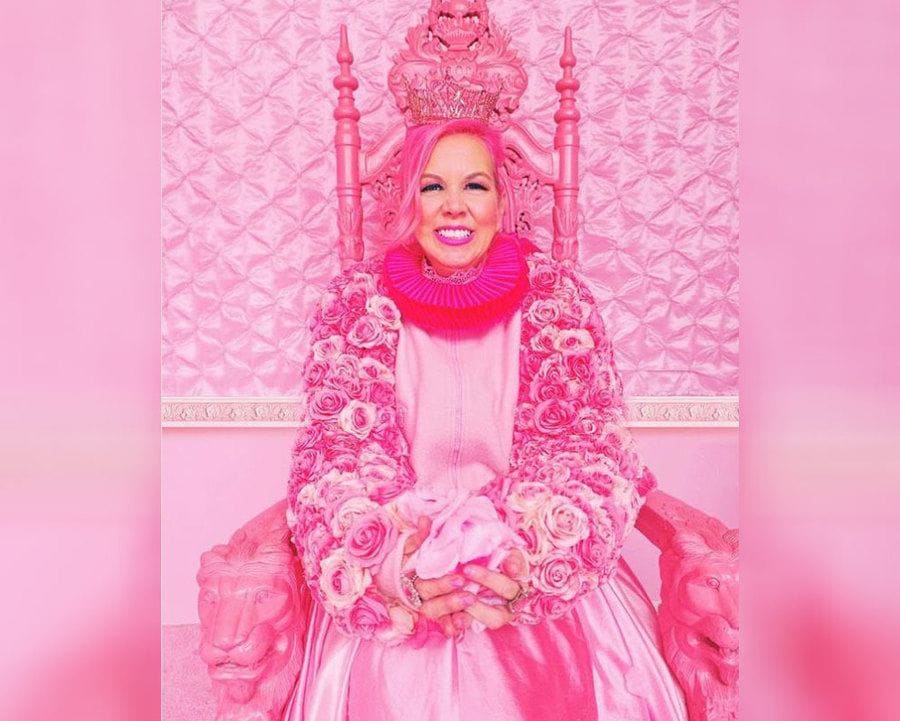 Kitten Kay Sera sitting in her pink chair in all pink 