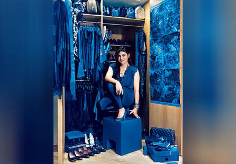 Valeria McCulloh in all blue standing in her closet. 