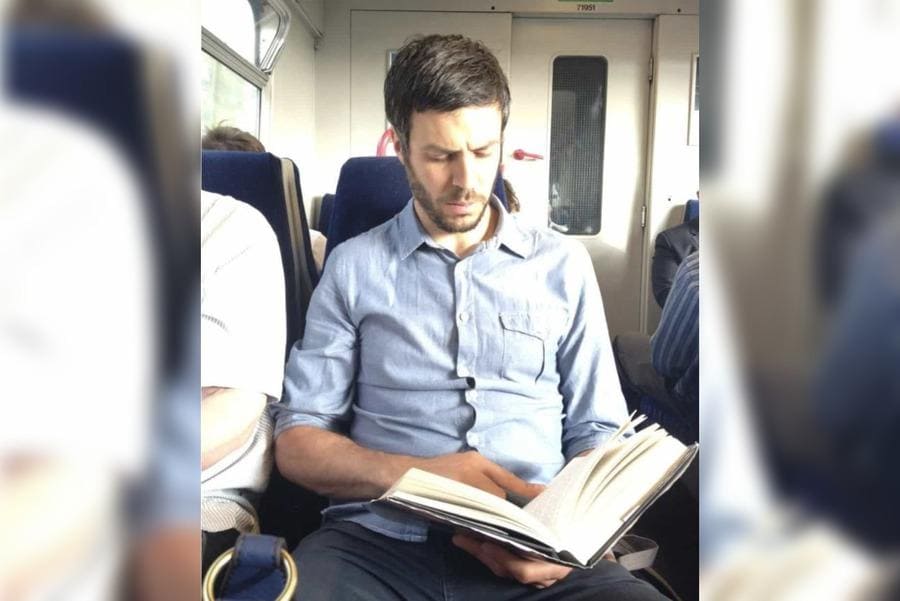 Mark sitting on a train