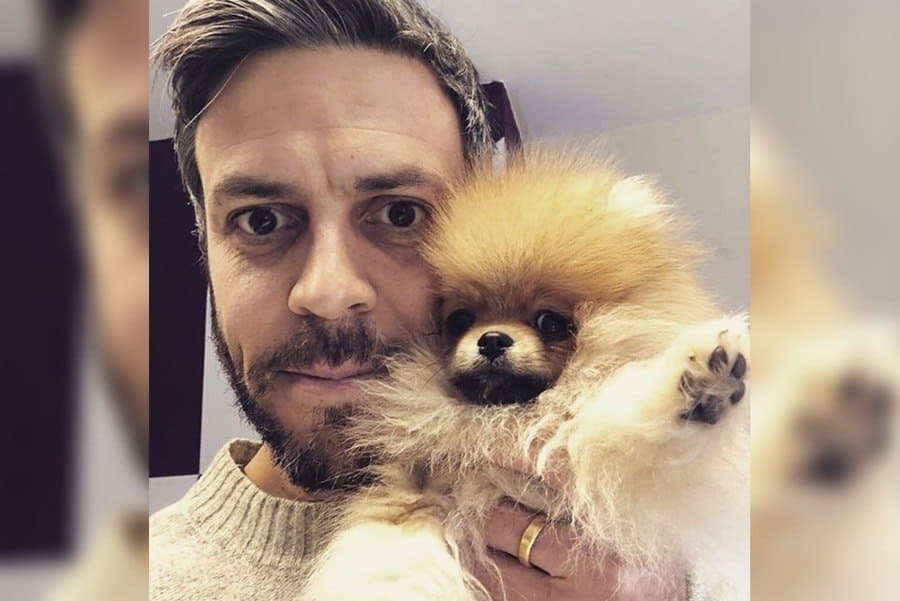 Mark Folbigg holding a dog