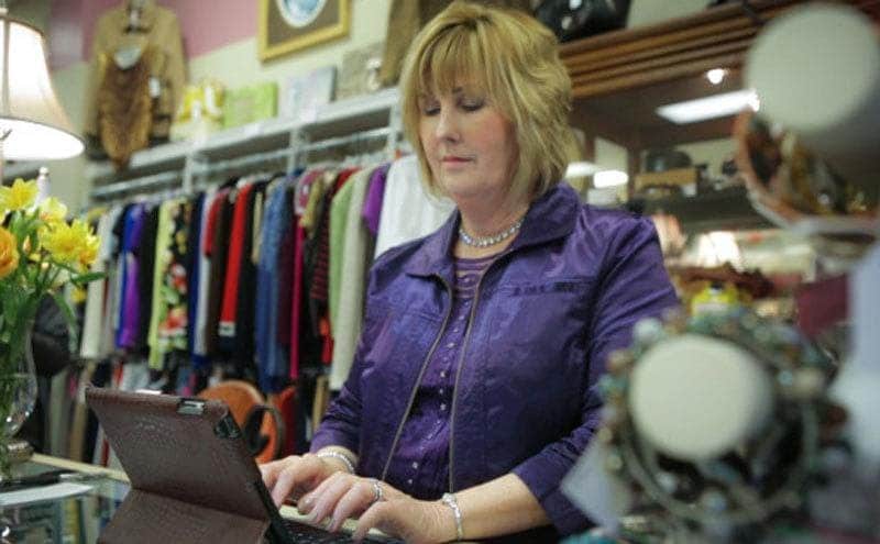 Kay working in her consignment shop